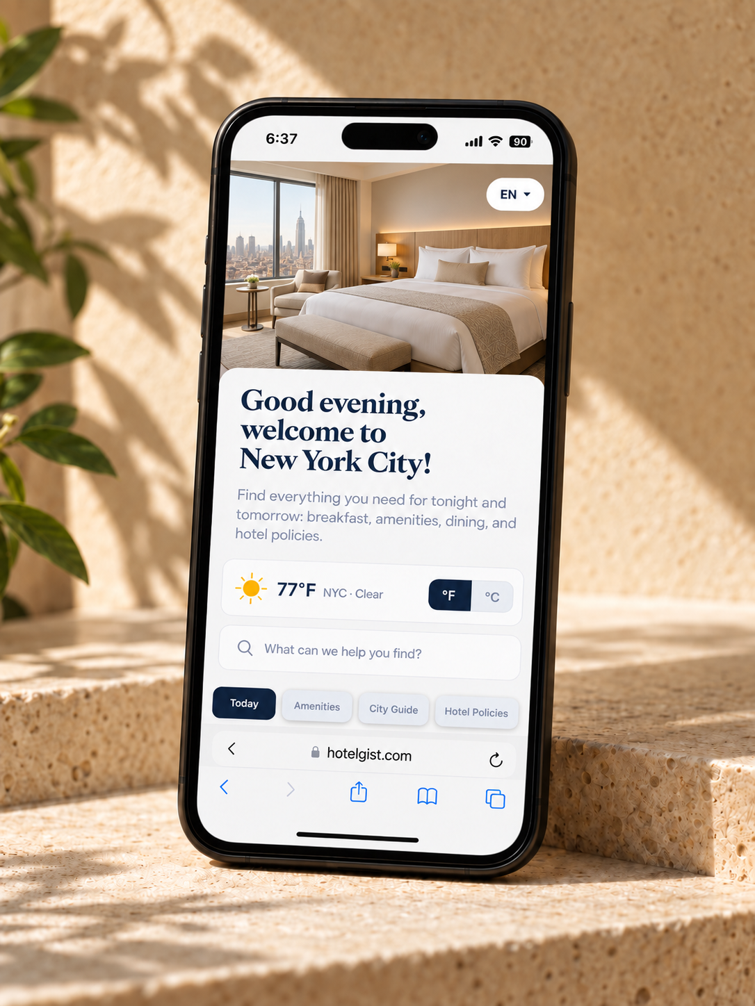 An illustrative hotel guest guide displayed on a phone in a warm hotel setting